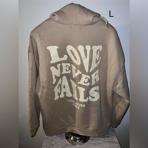 ‘Love never fails’ sweatshirt